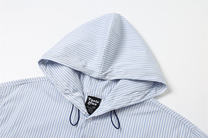 Striped hood with drawstring on a light blue and white button-up shirt