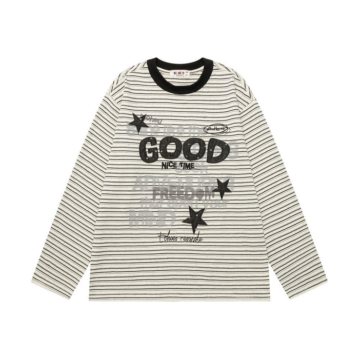 Front view of a cream striped long-sleeve tee with bold GOOD lettering, stars, and a black ribbed collar