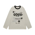 Front view of a cream striped long-sleeve tee with bold GOOD lettering, stars, and a black ribbed collar