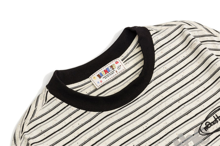 Close-up of the striped tee neckline showing the dark ribbed collar and sewn-in clothing label
