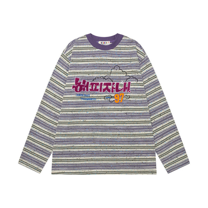Purple and cream striped long-sleeve shirt shown front-facing with colorful embroidered chest graphic