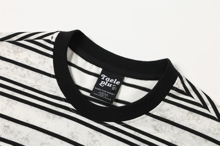 Close-up of black ribbed crew neck on a white striped long-sleeve T-shirt