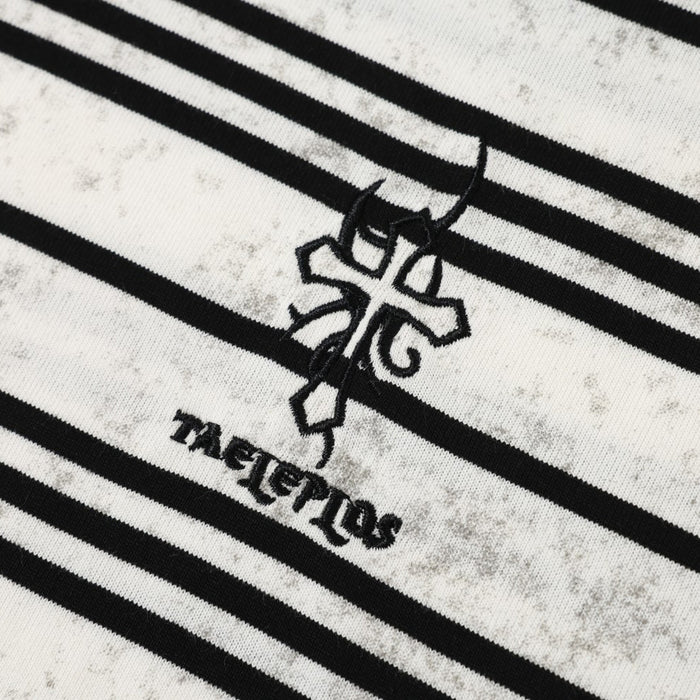 Close-up of chest logo embroidery on white striped fabric