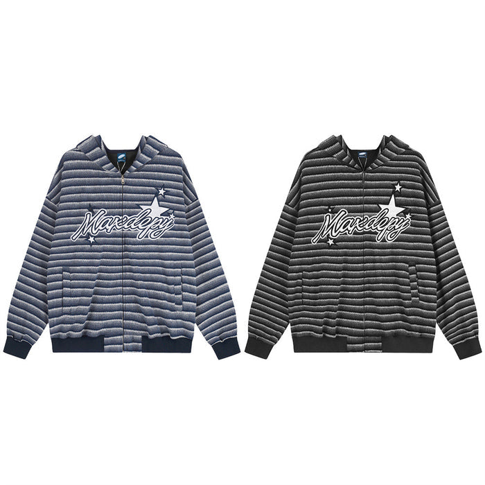 Front view of striped knit zip-up hoodies in navy and black with large script chest graphics and stars