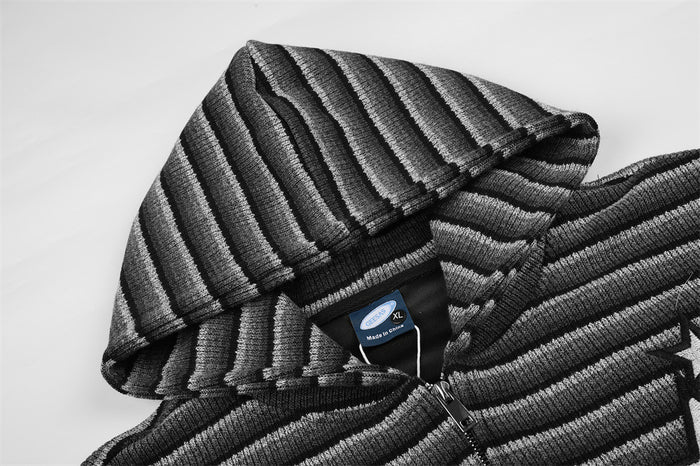Close-up of the striped knit hood, collar, and zip-up neckline in black and gray
