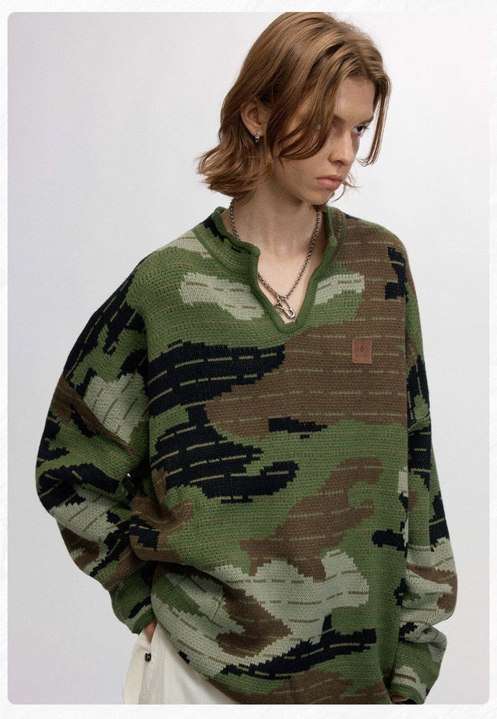 Green camo pullover sweater worn by model, angled front view with split neckline