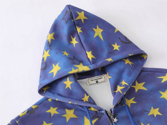 Close-up of blue star-print hood showing the lining, drawstrings, and stitched hood construction
