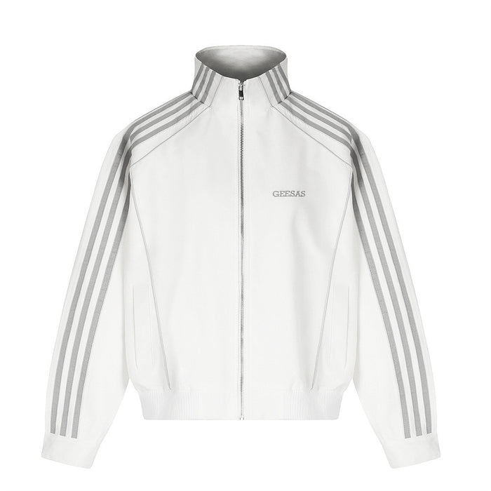 Men's white three-stripe mock neck zip-up track jacket with grey stripe tape detail and ribbed hem