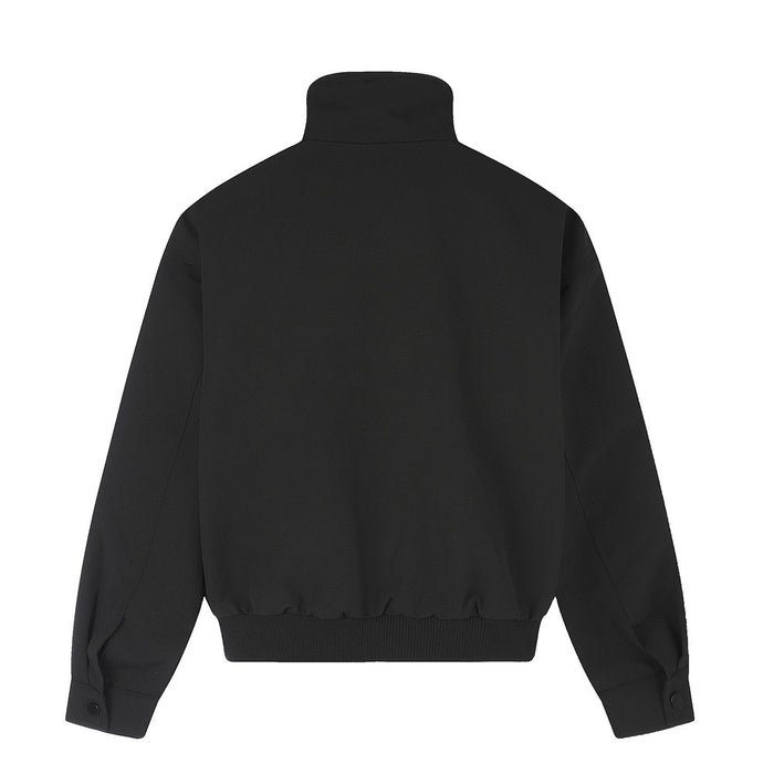 Black mock neck track jacket shown from the back with a plain panel, buttoned cuffs, and ribbed hem
