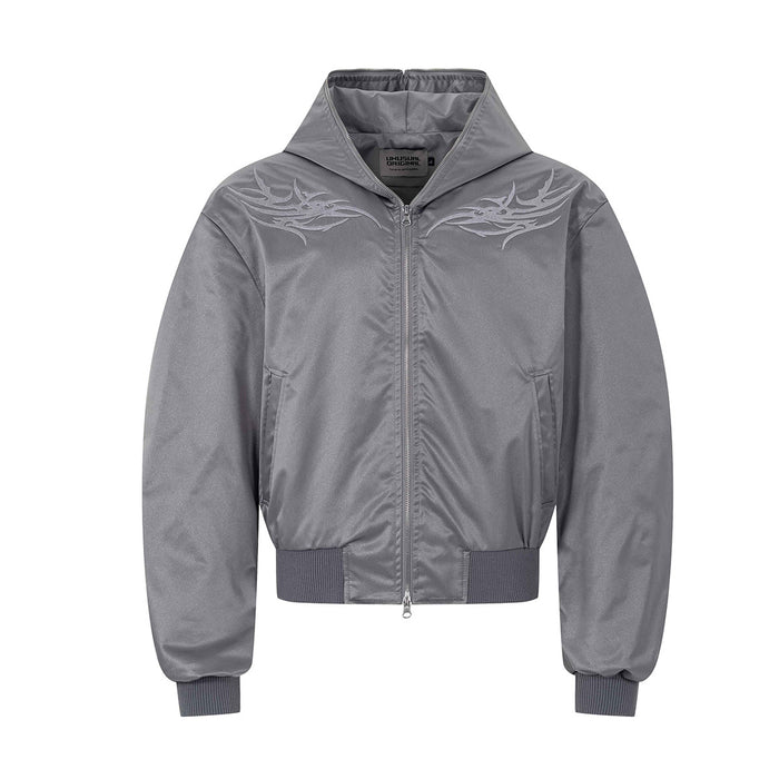 Boxy hooded bomber jacket with tribal flame embroidery on chest in silver colorway, front view