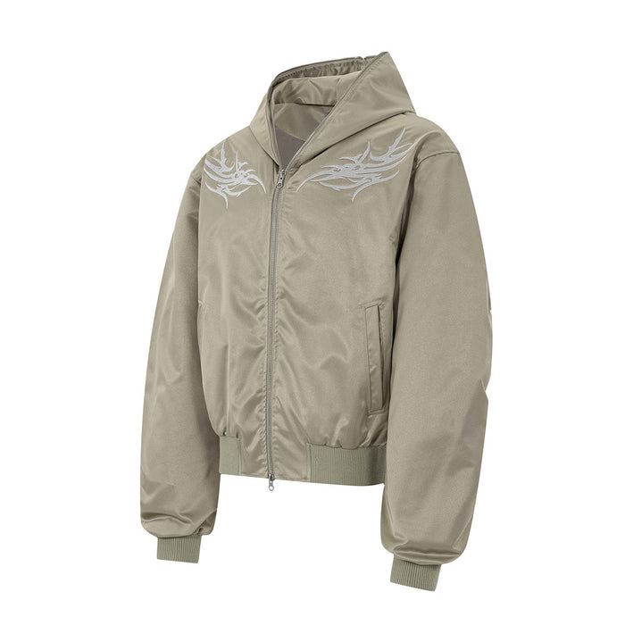 Beige hooded bomber jacket shown from a front three-quarter angle with light embroidered chest graphics