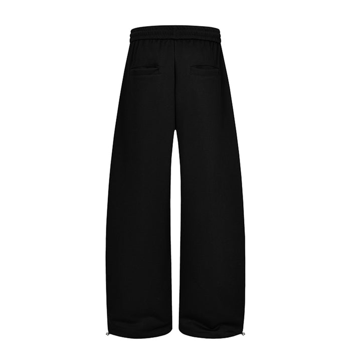 Back view of black wide-leg sweatpants showing two rear pockets and plain wide legs