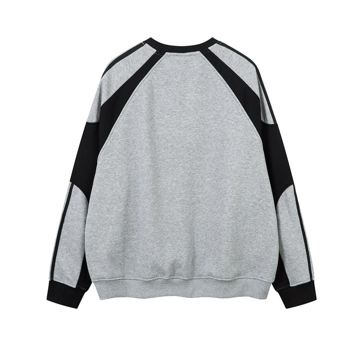 Back view of the gray sweatshirt with black colorblock raglan sleeves and striped shoulder panels