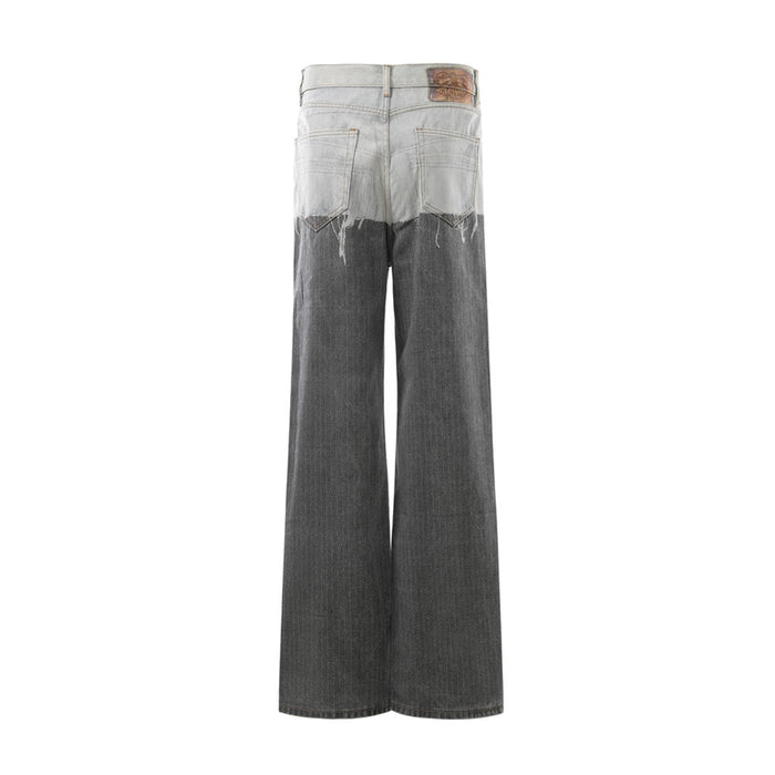 Back view of two-tone distressed wide-leg jeans with light wash yoke and dark gray legs