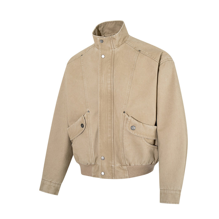 Washed khaki bomber jacket in a front three-quarter view, showing its stand collar, snap buttons, seam details and flap cargo pockets
