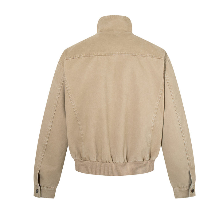 Back view of a washed khaki bomber jacket with a stand collar, seamed sleeves and ribbed hem