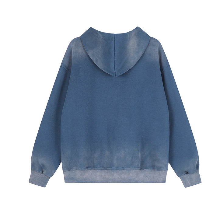 Plain back view of a washed blue zip-up hoodie with hood, long sleeves, and ribbed hem