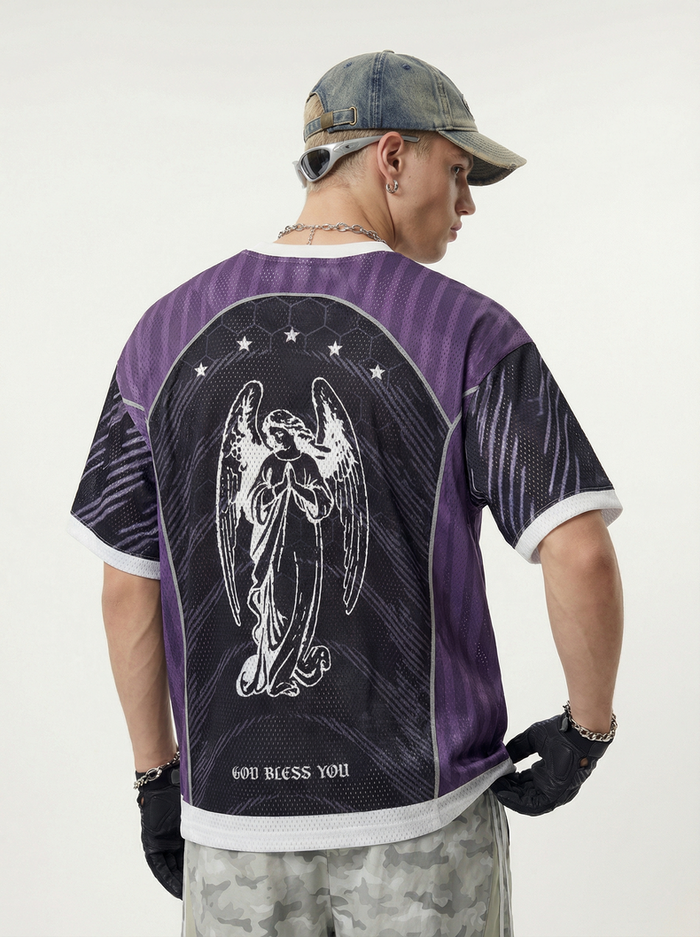 Back view of a purple gothic mesh jersey with angel graphic and God Bless You text, styled with cap and gloves