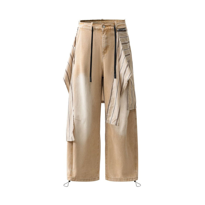 Front view of tan wide-leg jeans with striped detachable overlay and ankle drawcords
