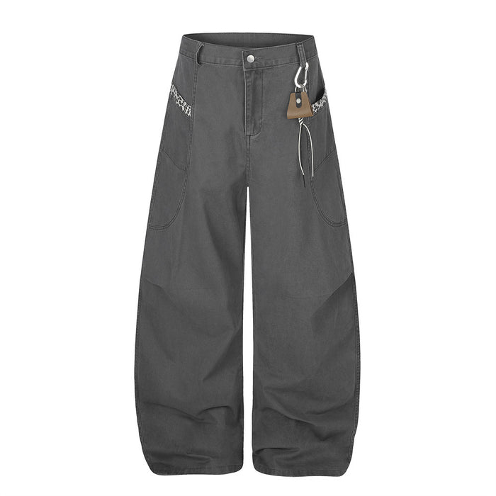 Charcoal wide-leg pants with leopard trim, curved hems, and carabiner detail, front view