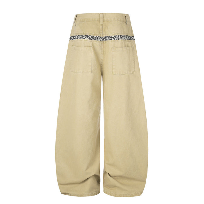 Beige wide-leg pants with leopard trim across the back waistband, back view