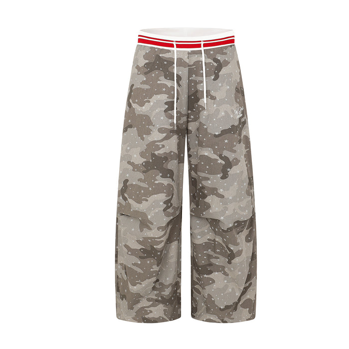 Wide-leg grey camouflage star print cargo pants with red stripe elastic waistband and white drawstring, front and back view