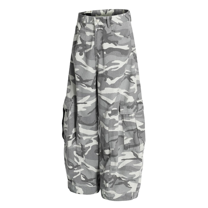 Angled front view of grey camouflage cargo pants with baggy legs and large side pockets