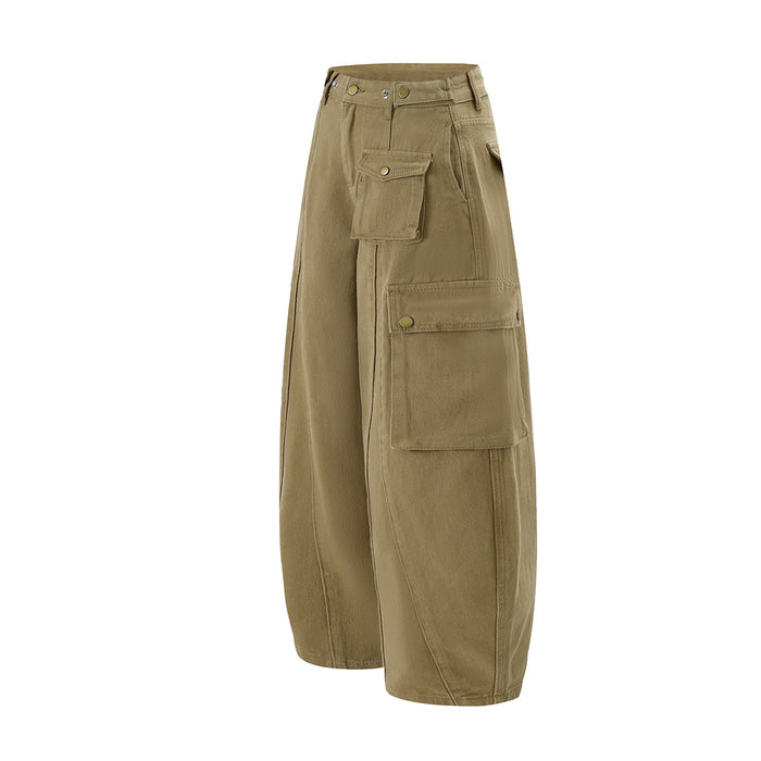 Angled side view of khaki wide-leg cargo pants showing layered flap pockets and rounded barrel legs