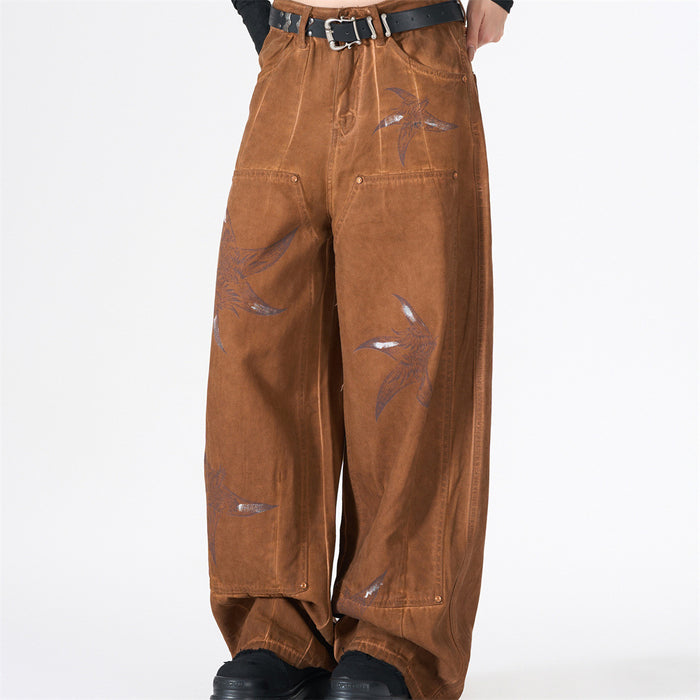 Front view of baggy brown cargo pants with bird print and black belt