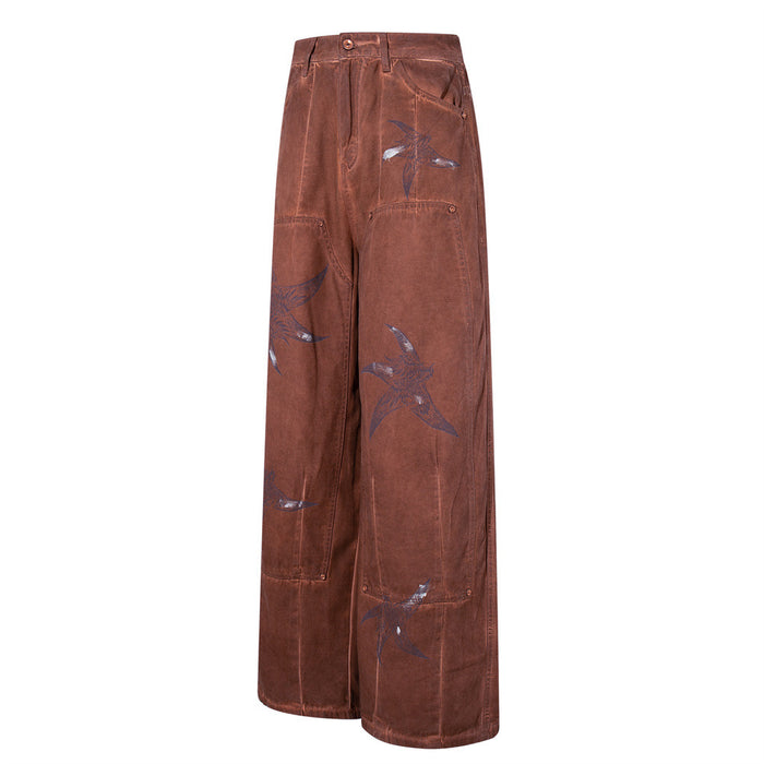 Side angle of brown wide-leg cargo pants with bird print