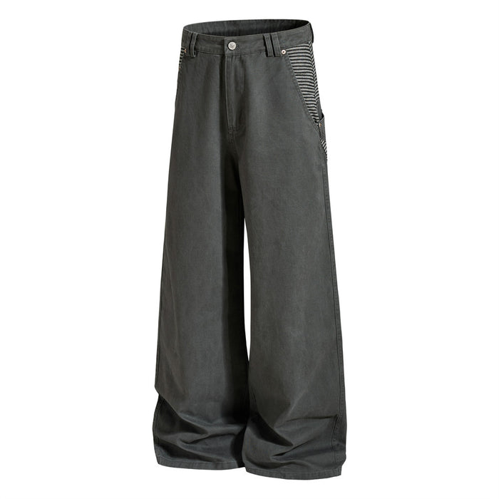 Three-quarter front view of dark gray wide-leg cargo pants with striped side pockets