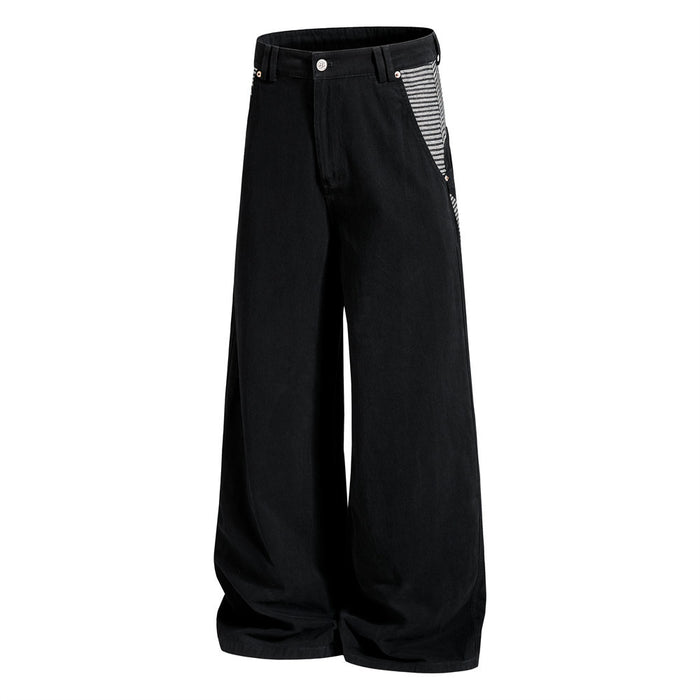 Three-quarter front view of black wide-leg cargo pants with striped side pocket panels