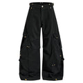 Wide-leg deconstructed cargo pants with multi-pocket design and gold hardware in washed black