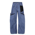 Blue wide-leg cargo pants with black side panels and multiple pockets, front view