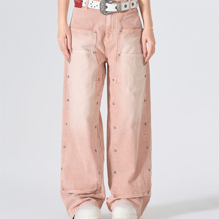 Front view of pink washed wide-leg carpenter jeans with patch pockets and studded seams