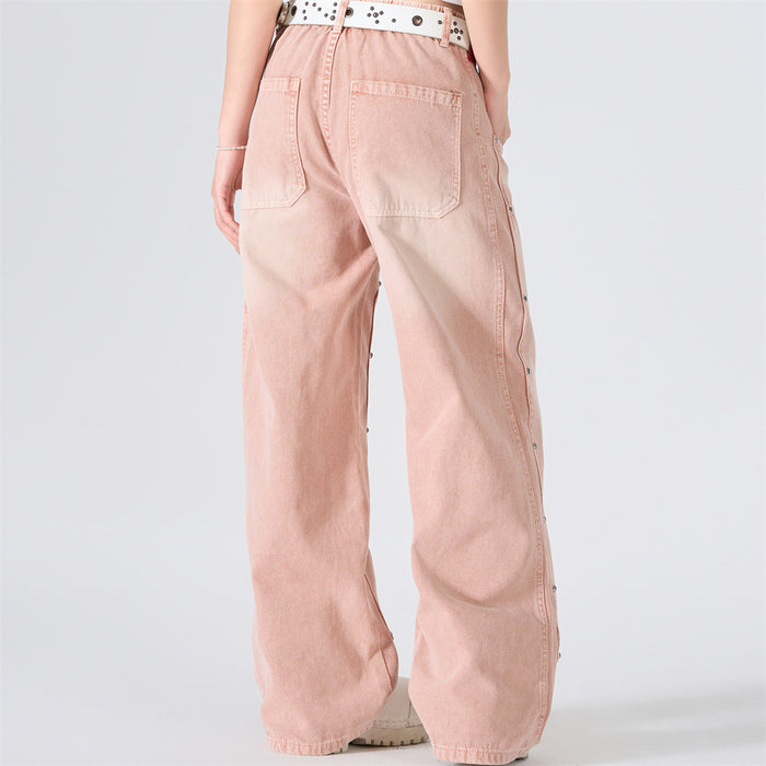 Back view of pink washed wide-leg carpenter jeans with patch pockets and studded side seams
