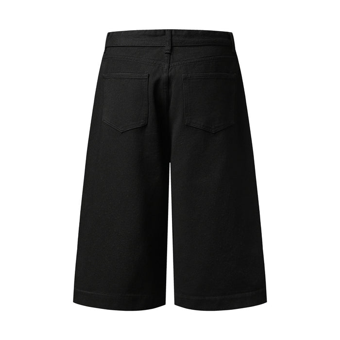 Plain black wide-leg denim shorts, back view