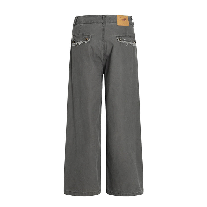 Back view of charcoal wide-leg pants with frayed pocket edges and a back patch label