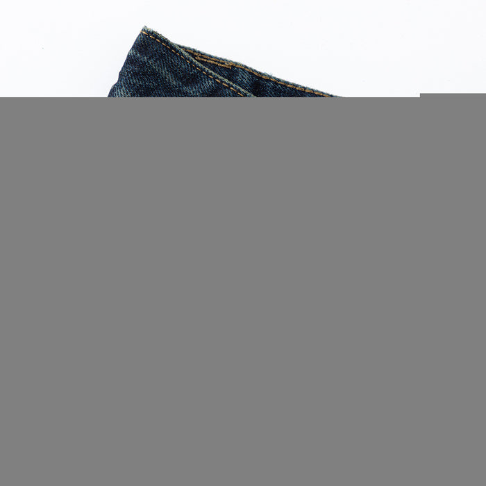 Close-up of jeans hem showing dark blue denim, contrast stitching, and folded edge