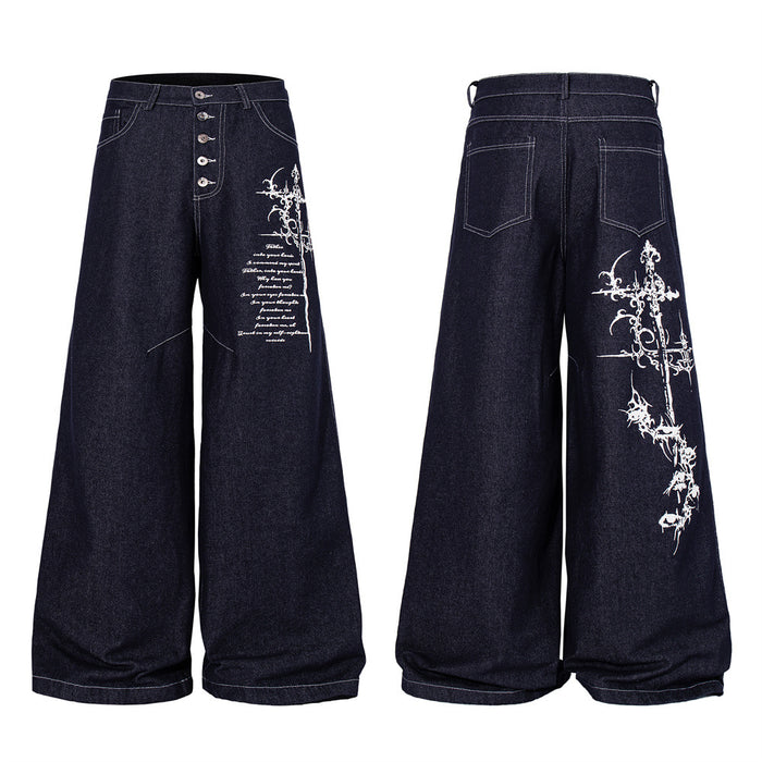 Dark indigo wide-leg jeans with gothic cross and script embroidery on the right leg, button fly closure, front and back view