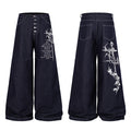 Dark indigo wide-leg jeans with gothic cross and script embroidery on the right leg, button fly closure, front and back view