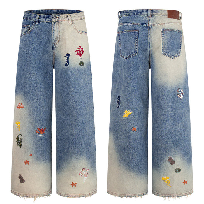 Wide-leg jeans with ocean embroidery and blue-to-cream gradient wash, front and back flat lay