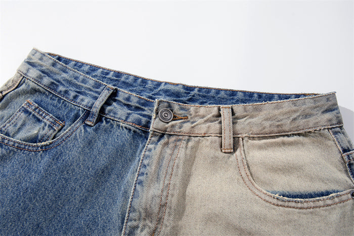 Close-up of the waistband and front button on two-tone denim jeans