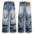Baggy wide-leg jeans in faded blue denim with white scratch-line print and paint splatter, front and back view