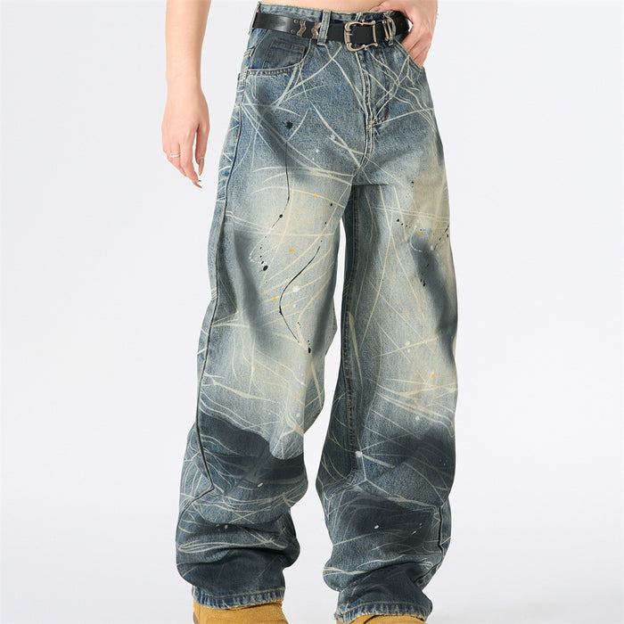Front view of blue baggy jeans with paint splatter lines and a relaxed wide leg