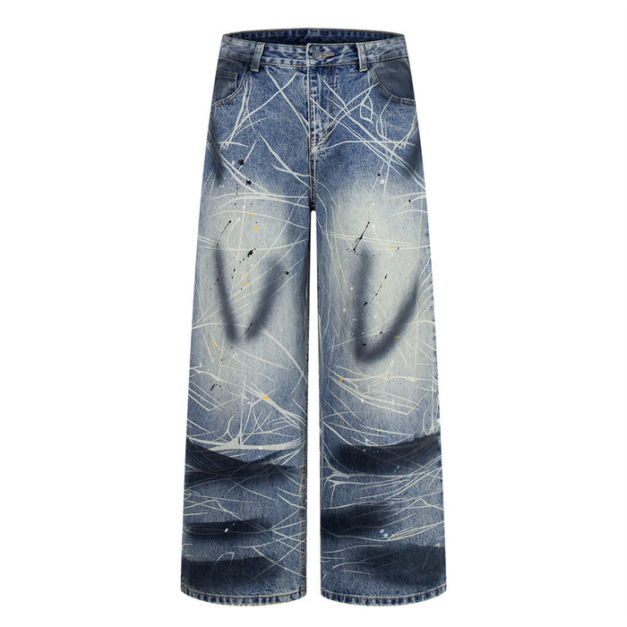 Front view of wide-leg blue jeans laid flat with paint splatter design