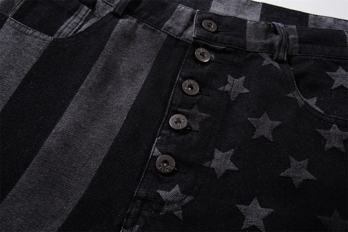 Close-up of button fly and front waistband on black stars and stripes jeans