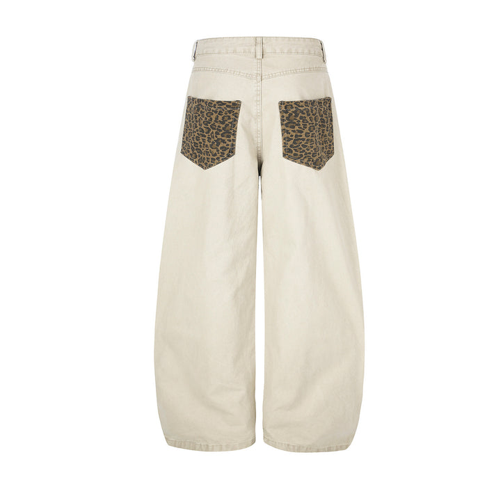 Back view of beige wide-leg pants featuring two leopard-print back pockets