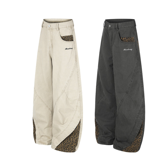 Beige and charcoal wide-leg pants shown together from a three-quarter front view