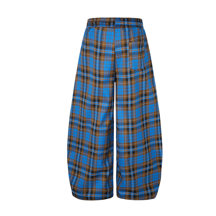 Back view of wide-leg blue and brown plaid pants with a plain waistband and full-length tartan pattern